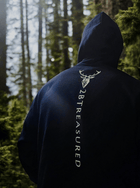 Embroidered Glen Etive Hoodie with British Flag in Navy back view with model in forest