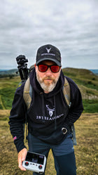 Embroidered Lomond Hoodie with British Flag worn by male model in the countryside front view