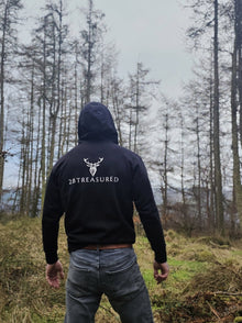 Male model wearing the Embroidered Stag Lomond Hoodie in Black back view from 2BTreasured
