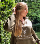 Female model wearing Embroidered Stagmoor Quarter Zip Country Green close up front view
