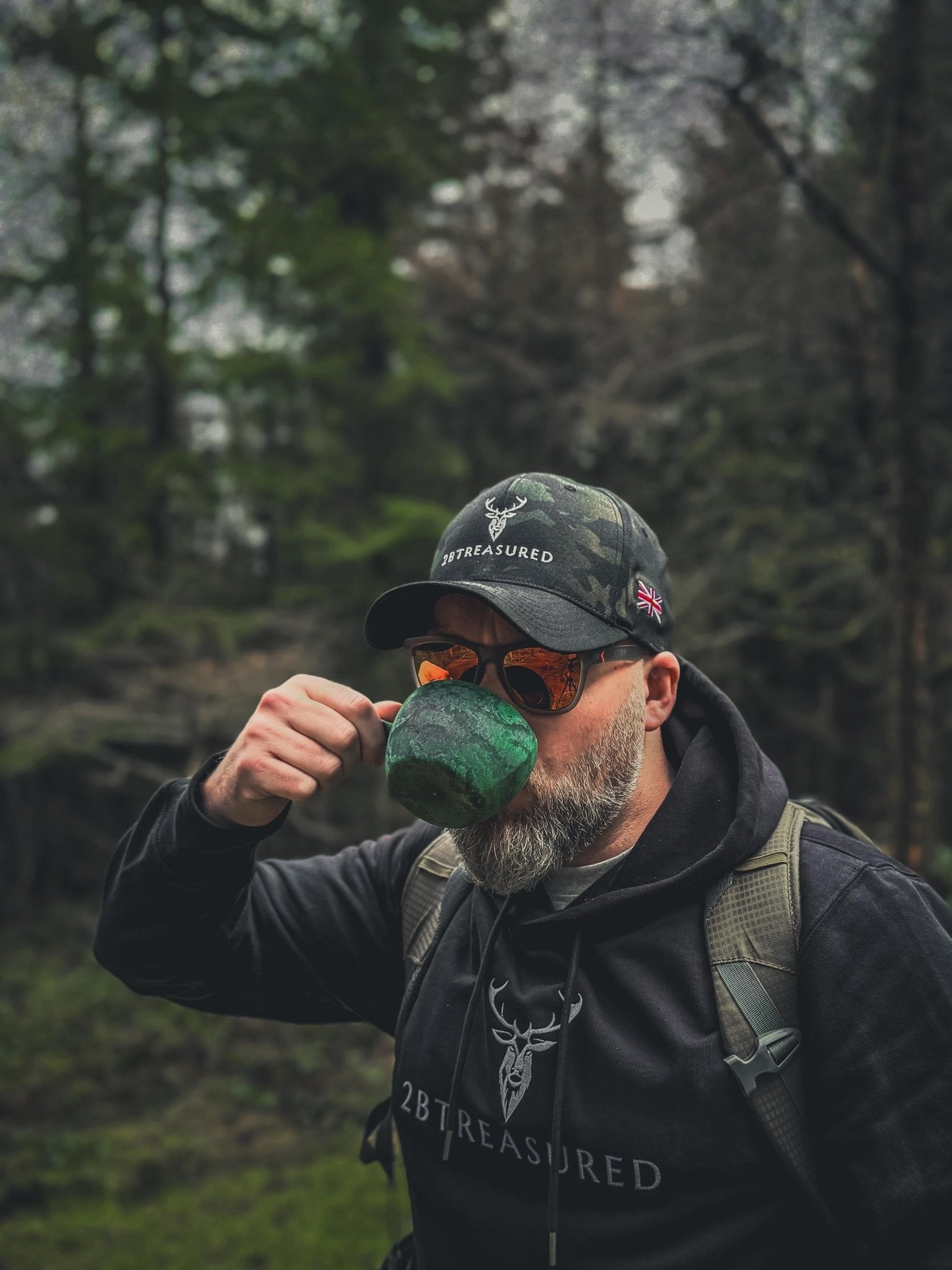 Man wearing the Embroidered Structured Camo Cap, Multicam with British Flag and hoodie from 2BTreasured