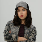 Model wearing the Embroidered Trucker Snapback Cap heather black colour