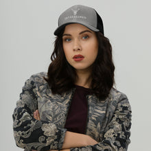 Model wearing the Embroidered Trucker Snapback Cap heather black colour