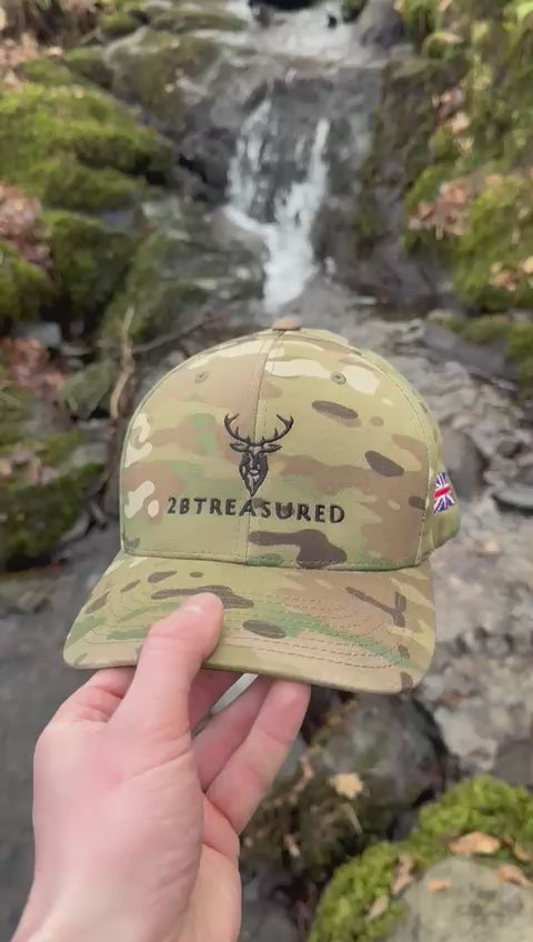 Video showcasing the Multicam Green Camo Cap next to small waterfall