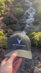 Video showcasing the Embroidered Structured Mullticam Camo Cap with British Flag in a woodland area